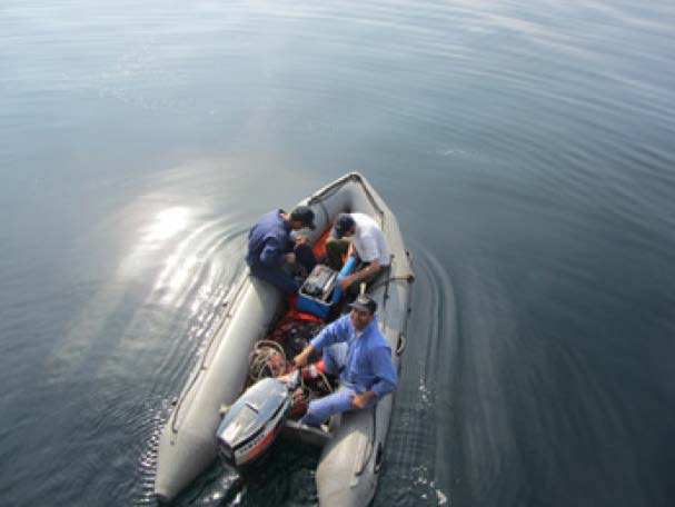 Searching for a mooring system using a transponder and acoustic release